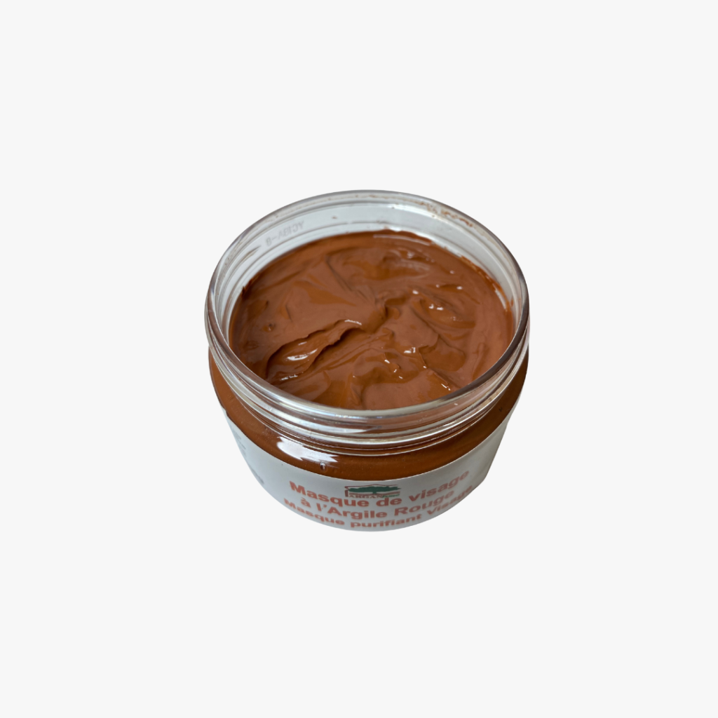An Arganisme clay face mask in an open jar
